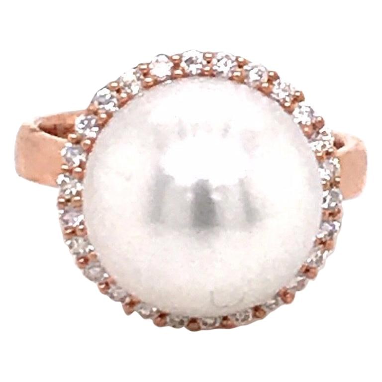 Harbor Diamonds South Sea Pearl Diamond Halo Ring 0.32ct 18K Rose Gold: Harbor Diamonds South Sea Pearl Diamond Halo Ring 0.32ct 18K Rose Gold This stunning 18K rose gold ring showcases a beautiful South Sea pearl, measuring 13-14 mm, elegantly surrounded by a halo of 26