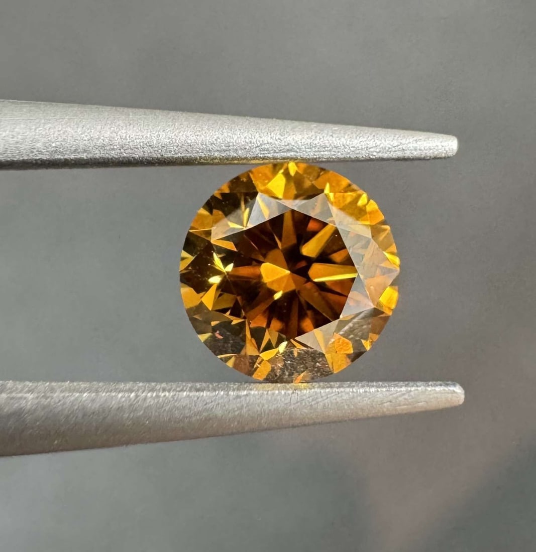 Loose Diamond - ROUND 0.6ct Fancy Deep Brownish Yellowish Orange SI1: Loose Diamond - ROUND 0.6ct Fancy Deep Brownish Yellowish Orange SI1 Source: Natural Shape: ROUND Carats: 0.6 Color: Fancy Deep Brownish Yellowish Orange Certification: GIA Video: