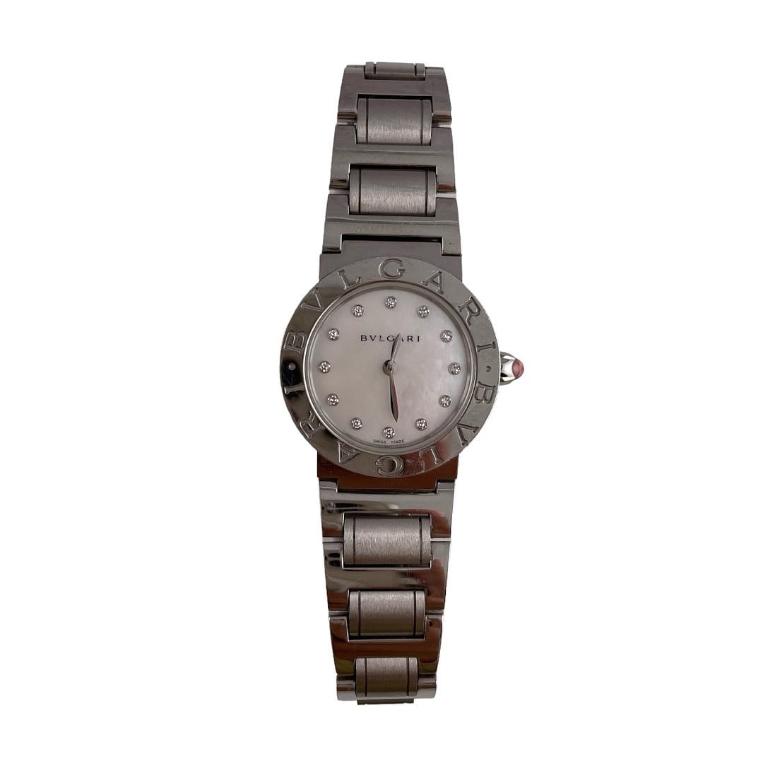 26mm BBL26S Stainless Steel Watch with Mother of Pearl Diamond Dial: 26mm BBL26S Stainless Steel Watch with Mother of Pearl Diamond Dial This Bvlgari watch features a 26mm stainless steel case and a mother-of-pearl diamond dial. It is a pre-owned timepiece with a link