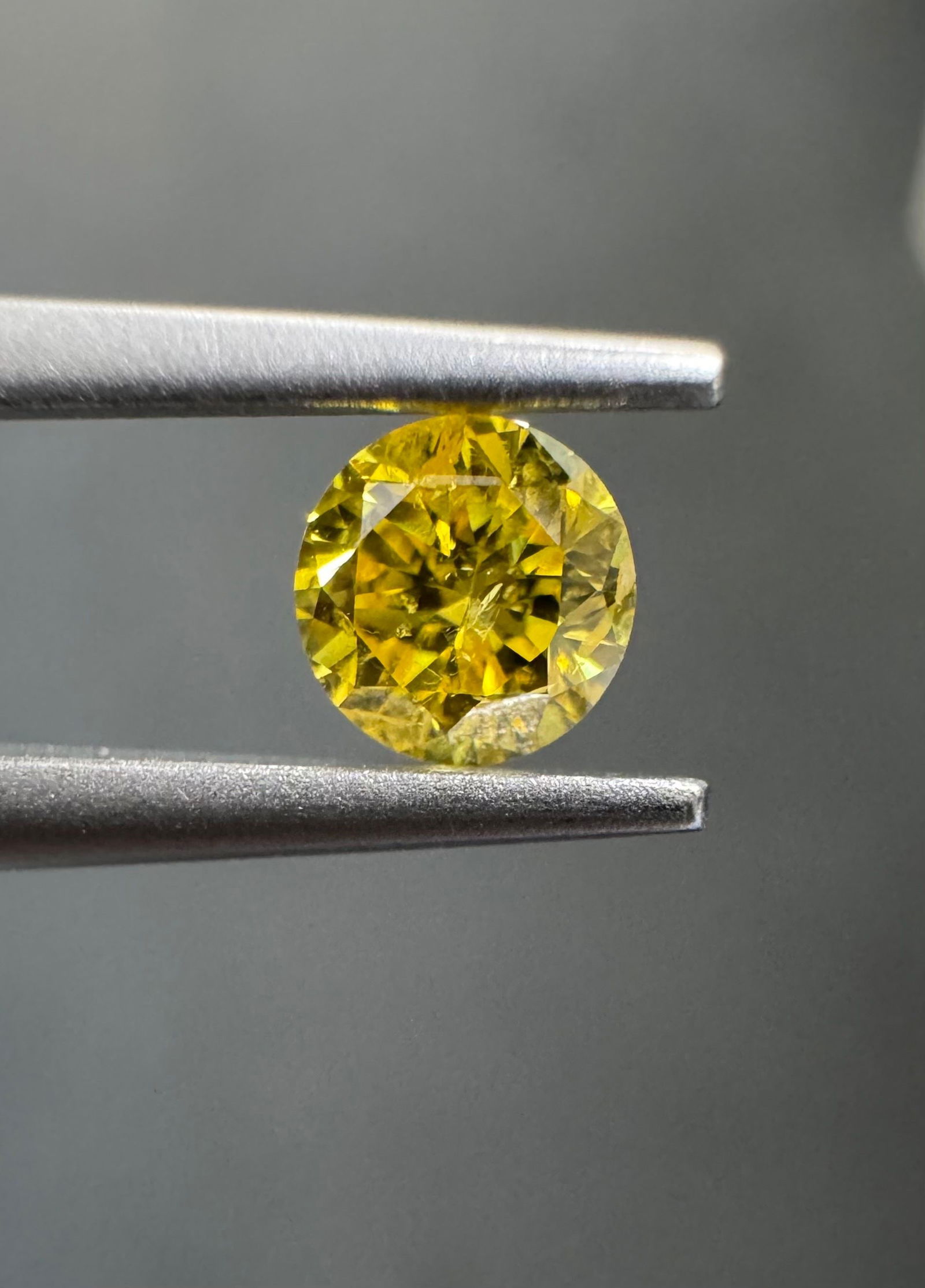Loose Diamond - ROUND 0.22ct Fancy Vivid Yellow I2: Loose Diamond - ROUND 0.22ct Fancy Vivid Yellow I2 Source: Natural Shape: ROUND Carats: 0.22 Color: Fancy Vivid Yellow Certification: GIA The Diamond Depot Guarantee: All items in this auction are gua