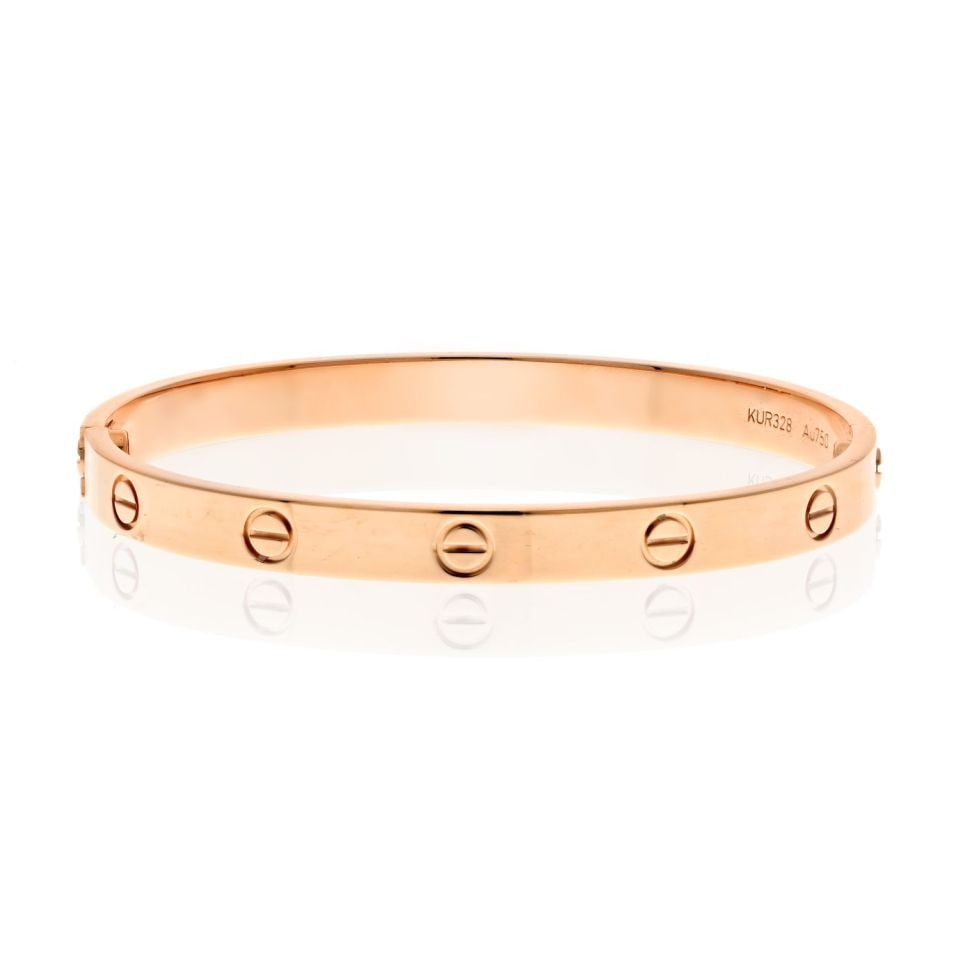 Cartier Love 18K Rose Gold Bracelet Size 18 Authentic: Cartier Love 18K Rose Gold Bracelet Size 18 Authentic This exquisite Cartier Love Bracelet is crafted in luxurious 18K rose gold and weighs 34 grams. Designed in the iconic Love style, it features a t