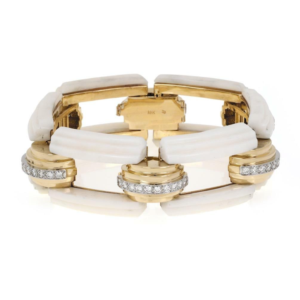 Stunning 3.00ct Diamond Coral 18k Gold Fancy Link Bracelet: Stunning 3.00ct Diamond Coral 18k Gold Fancy Link Bracelet This magnificent bracelet features an exquisite design crafted from 18k yellow gold with white gold accents. The piece showcases six double-s