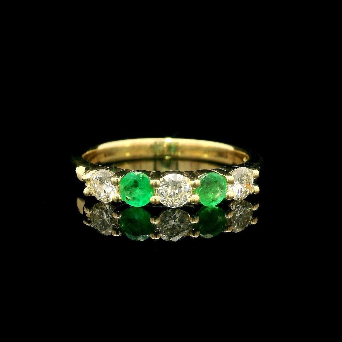 14k Yellow Gold Diamond Emerald Stack Band Ring 0.61ctw: 14k Yellow Gold Diamond Emerald Stack Band Ring 0.61ctw This stunning 14k Yellow Gold Shared Prong Alternating Diamond and Emerald Stack Band Ring features a beautiful combination of natural gemstones
