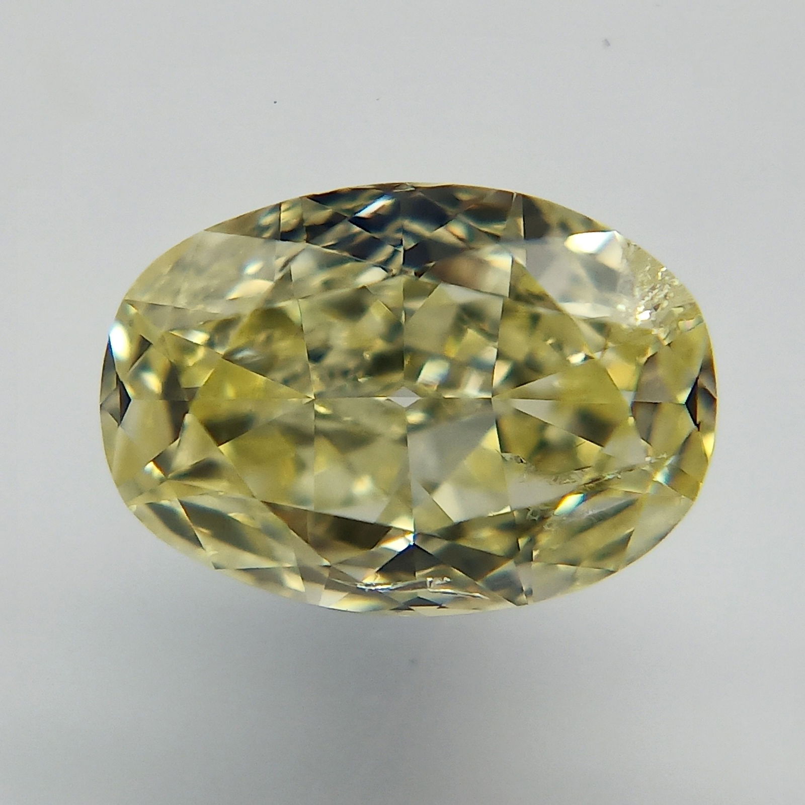 Loose Diamond - OVAL 0.52ct Fancy Yellow: Loose Diamond - OVAL 0.52ct Fancy Yellow Source: Natural Shape: OVAL Carats: 0.52 Color: Fancy Yellow Certification: GIA The Diamond Depot Guarantee: All items in this auction are guaranteed to be 100