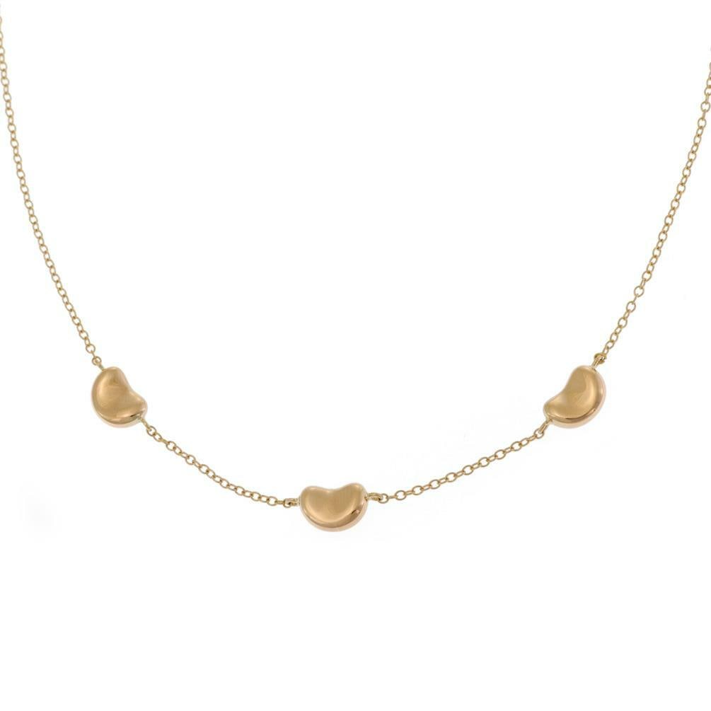 Tiffany & Co. Elsa Peretti 3 Bean Charms 18k Gold Necklace: Tiffany & Co. Elsa Peretti 3 Bean Charms 18k Gold Necklace Discover the elegance of Tiffany & Co. with this stunning necklace designed by Elsa Peretti, featuring her iconic Bean Collection. Crafted fr