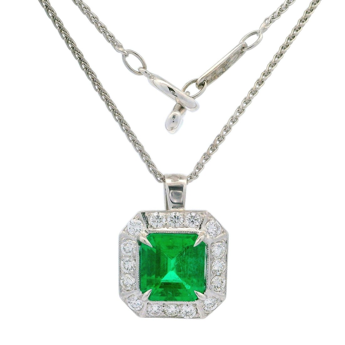 18k White Gold Emerald Diamond Pendant AGL Certified on 16" Wheat Necklace: 18k White Gold Emerald Diamond Pendant AGL Certified on 16" Wheat Necklace This exquisite pendant features a natural emerald cut emerald, showcasing a vivid green color with an approximate weight of 2