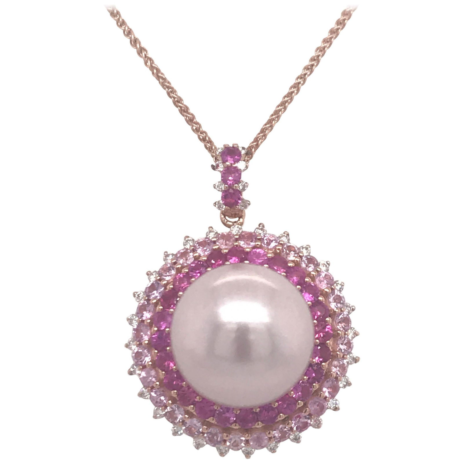 Harbor Diamonds 18K Rose Gold Pink Sapphire Pearl Pendant Necklace: Harbor Diamonds 18K Rose Gold Pink Sapphire Pearl Pendant Necklace This exquisite pendant necklace is crafted in 18K rose gold and showcases a stunning pink freshwater pearl, measuring 13-14 mm, as it