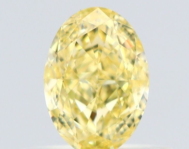 Loose Diamond - OVAL 0.51ct Fancy Yellow VS2: Loose Diamond - OVAL 0.51ct Fancy Yellow VS2 Source: Natural Shape: OVAL Carats: 0.51 Color: Fancy Yellow Certification: GIA The Diamond Depot Guarantee: All items in this auction are guaranteed to be