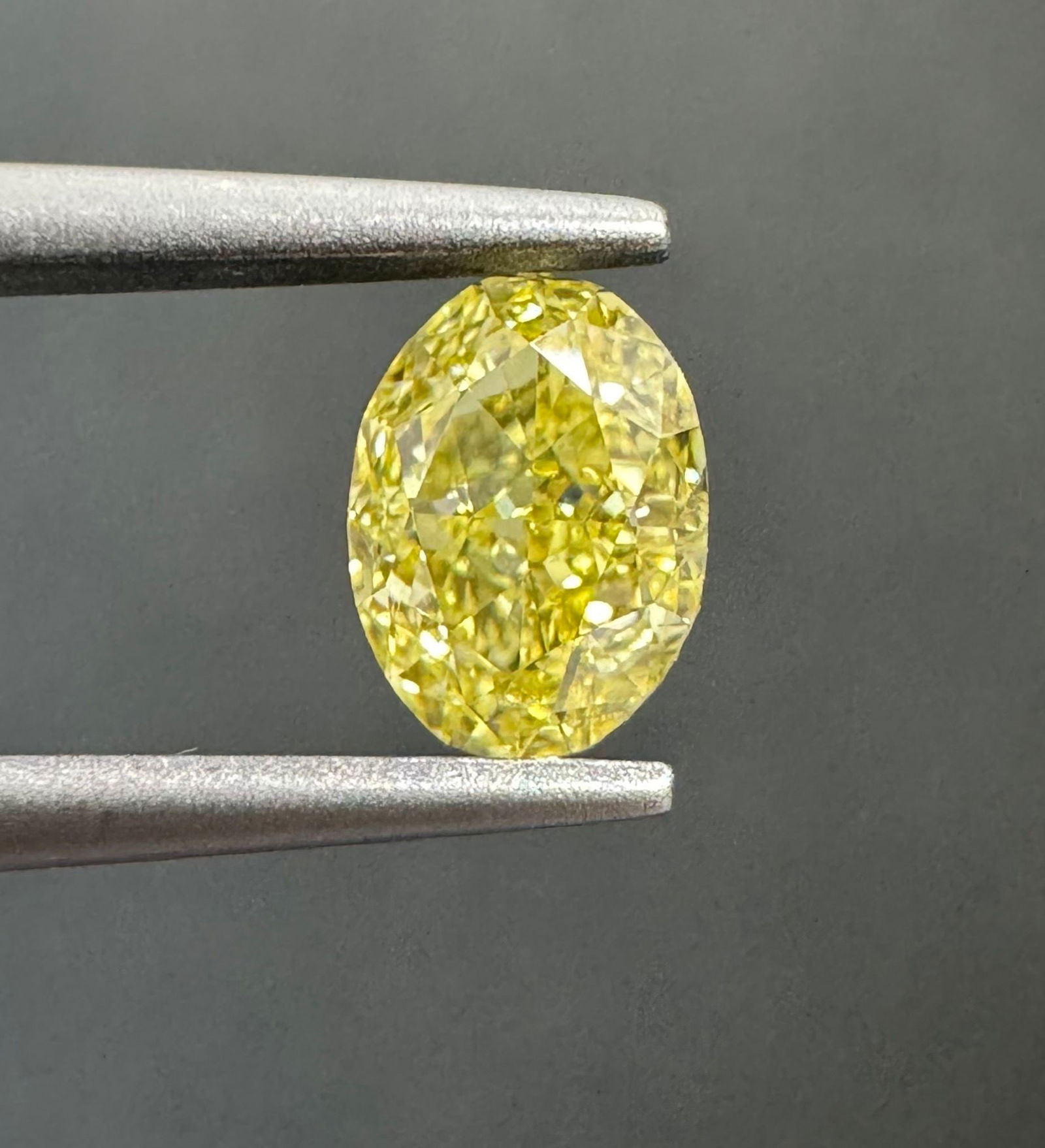 Loose Diamond - OVAL 0.74ct Fancy Intense Yellow VVS1: Loose Diamond - OVAL 0.74ct Fancy Intense Yellow VVS1 Source: Natural Shape: OVAL Carats: 0.74 Color: Fancy Intense Yellow Certification: GIA The Diamond Depot Guarantee: All items in this auction are
