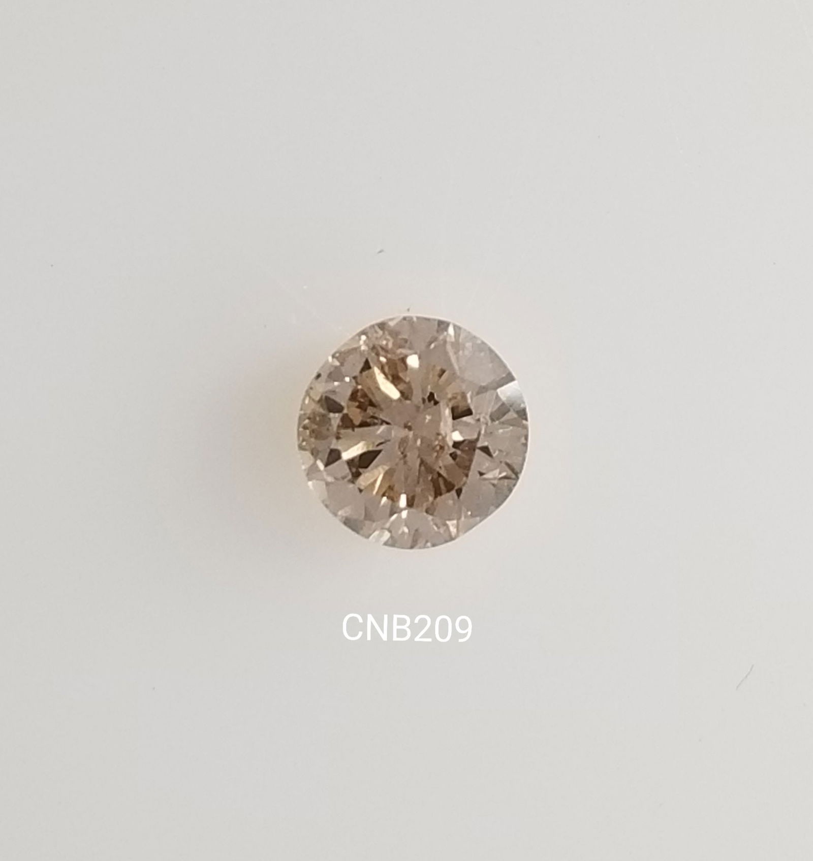 Loose Diamond - ROUND 0.67ct Fancy Light Brown I1: Loose Diamond - ROUND 0.67ct Fancy Light Brown I1 Source: Natural Shape: ROUND Carats: 0.67 Color: Fancy Light Brown Certification: NONE The Diamond Depot Guarantee: All items in this auction are guar