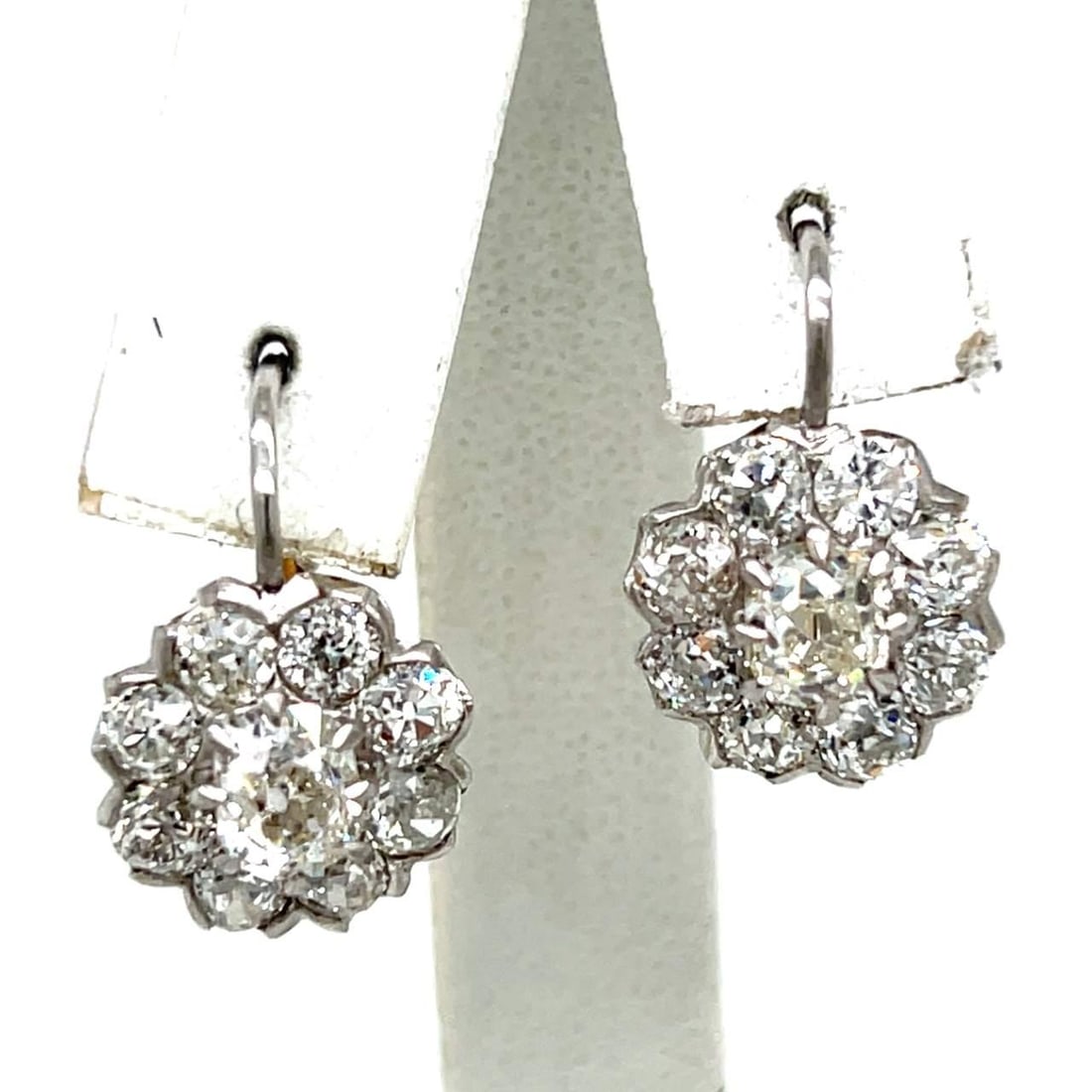 Platinum 18K Yellow Gold Diamond Earrings 4.10 Ct Old Mine European-cut: Platinum 18K Yellow Gold Diamond Earrings 4.10 Ct Old Mine European-cut These exquisite earrings feature a stunning combination of platinum and 18K yellow gold. Weighing 6.3 grams, they are set with t