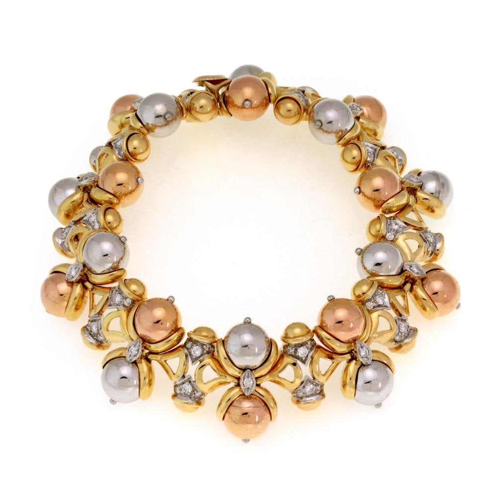 Elegant 1.00ct Diamond 18k Tricolor Gold Bead Link Bracelet: Elegant 1.00ct Diamond 18k Tricolor Gold Bead Link Bracelet This stunning bracelet showcases a unique design crafted from 18k yellow, rose, and white gold. The 7" long piece features a fancy bead link