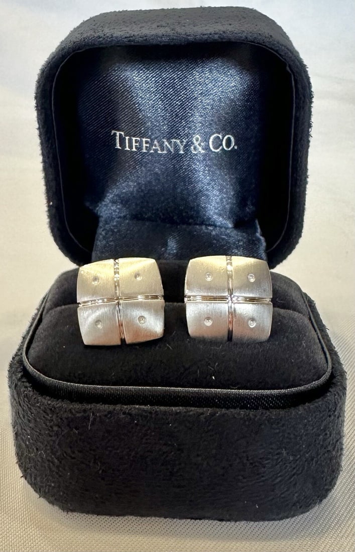 Tiffany & Co 18K White Gold Cufflinks with Original Boxes: Tiffany & Co 18K White Gold Cufflinks with Original Boxes Discover this exquisite pair of Tiffany & Co. cufflinks, crafted from luxurious 18k white gold. Weighing approximately 17.40g, each cufflink m