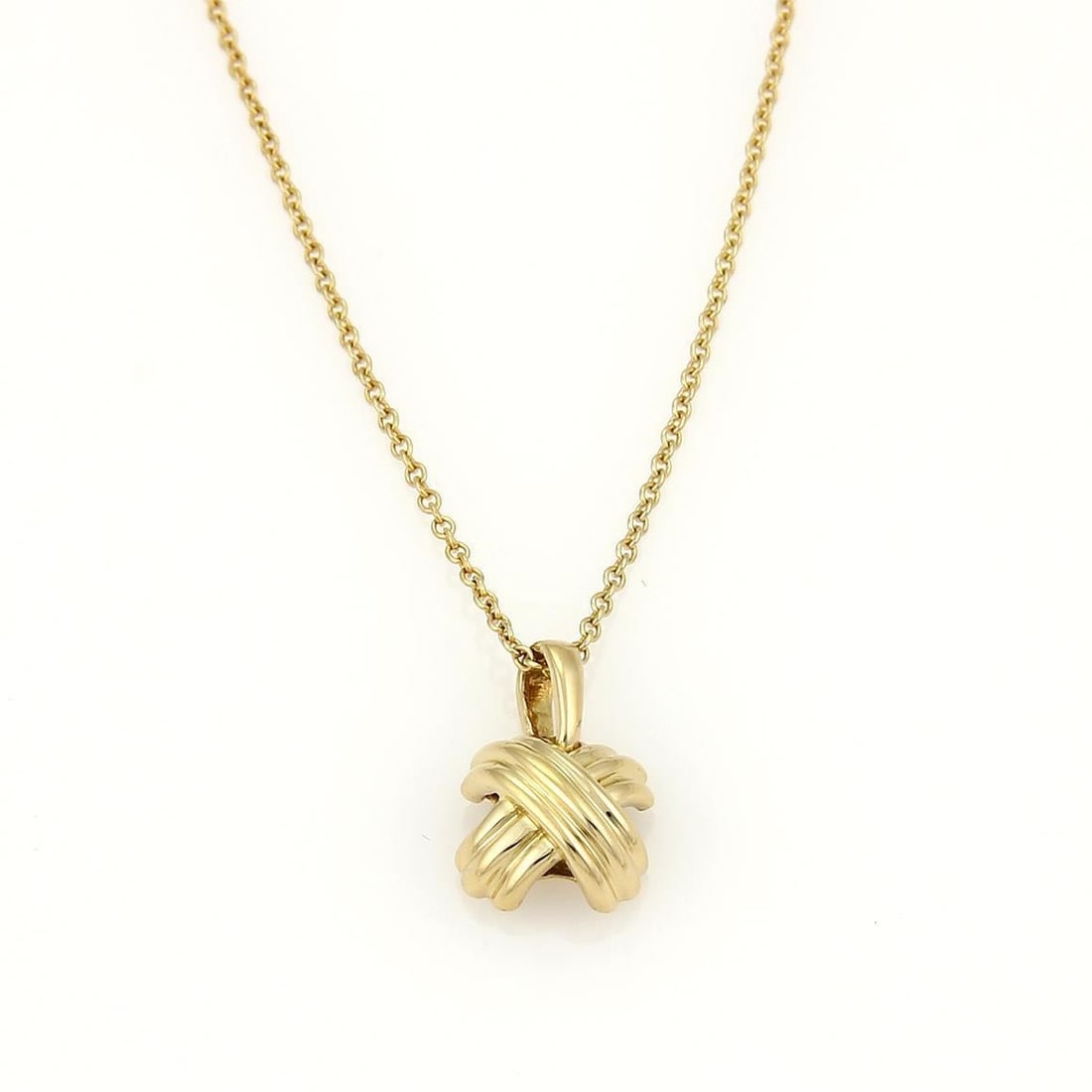 Tiffany & Co. 18k Yellow Gold Signature X Pendant with Chain: Tiffany & Co. 18k Yellow Gold Signature X Pendant with Chain This exquisite pendant and chain from Tiffany & Co. is part of the Signature X collection. Crafted in 18k yellow gold, it features a fine p