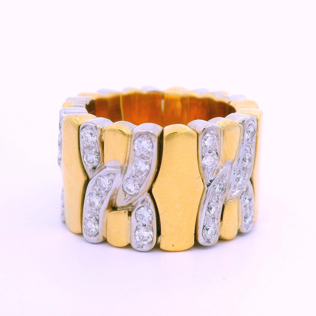 18K Yellow White Gold 1CTW Diamond Flexible Open Band Ring: 18K Yellow White Gold 1CTW Diamond Flexible Open Band Ring This stunning flexible band ring showcases a unique design crafted from solid 18k yellow and white gold. It features 50 natural genuine round