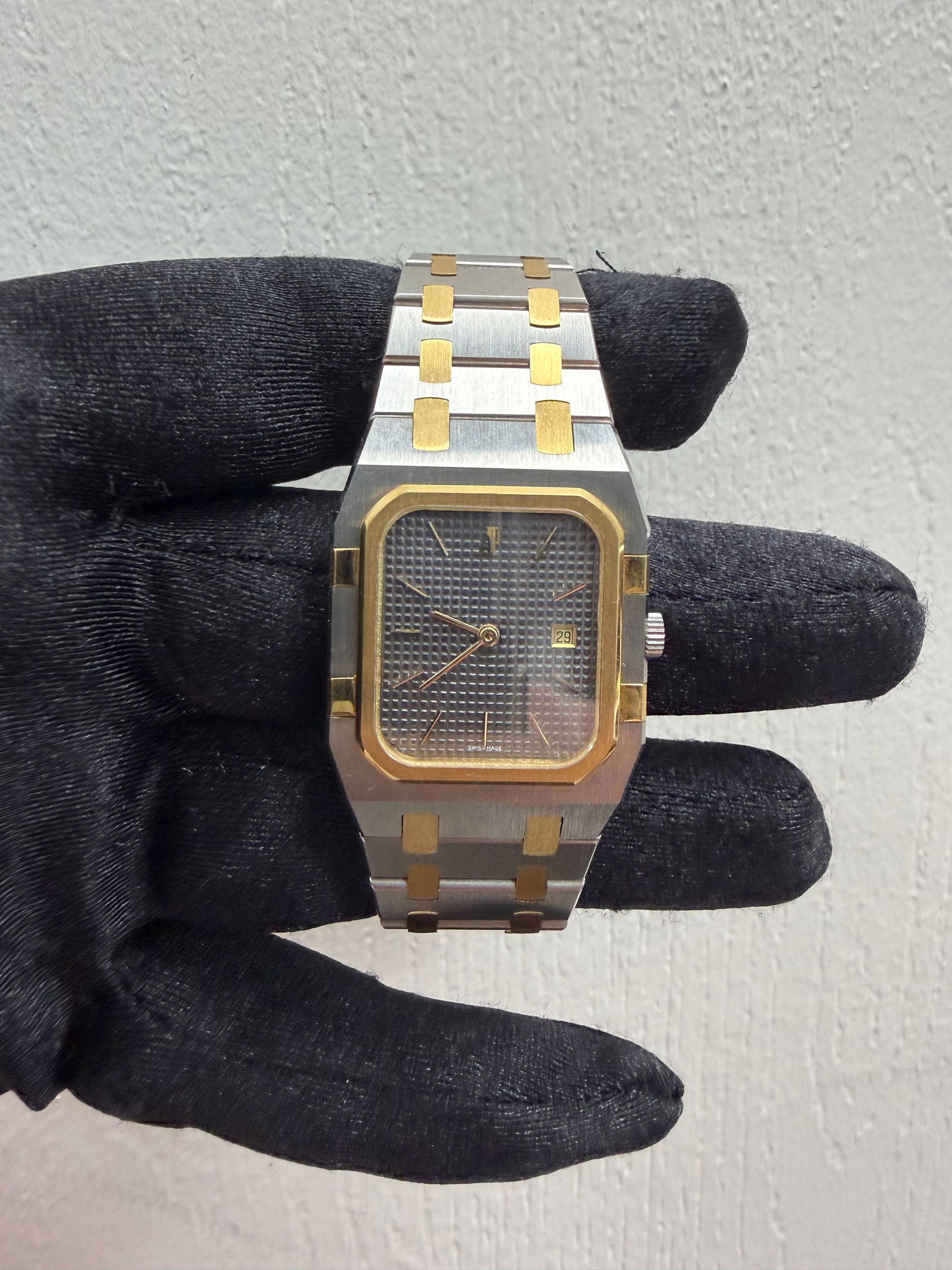 28mm Royal Oak Reference 56049SA Grey Dial 18k YG Stainless Watch: 28mm Royal Oak Reference 56049SA Grey Dial 18k YG Stainless Watch This Audemars Piguet Royal Oak features a 28mm case with a grey dial. The watch is crafted in a combination of 18k yellow gold and sta