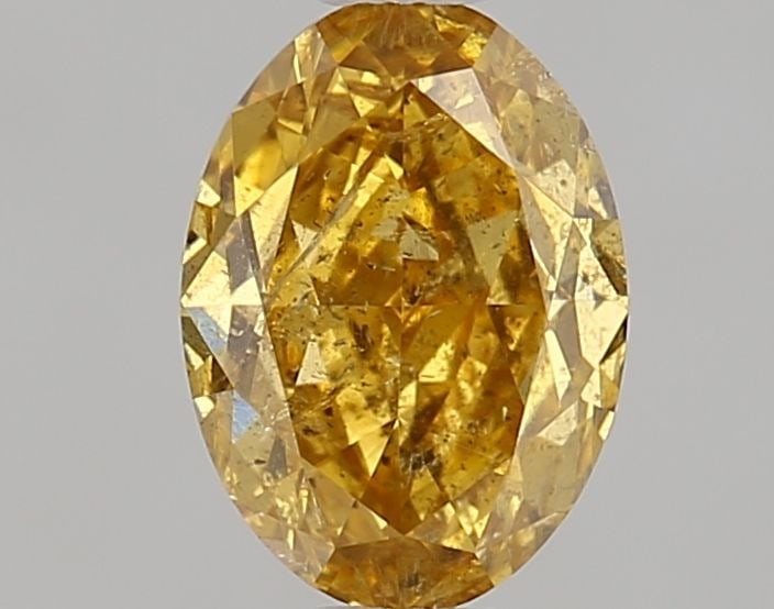 Loose Diamond - OVAL 0.7ct Fancy Deep Orangey Yellow I2: Loose Diamond - OVAL 0.7ct Fancy Deep Orangey Yellow I2 Source: Natural Shape: OVAL Carats: 0.7 Color: Fancy Deep Orangey Yellow Certification: NONE Video: