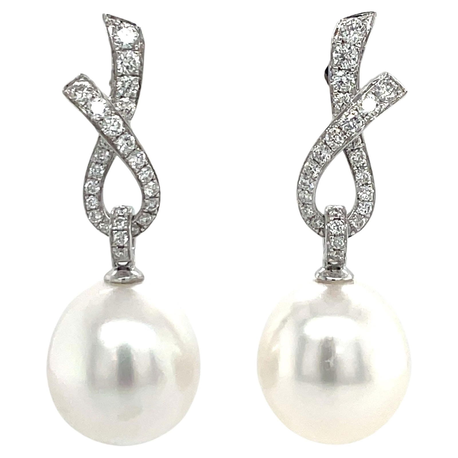 Harbor Diamonds 18K White Gold Diamond Ribbon South Sea Pearl Earrings 0.57ct: Harbor Diamonds 18K White Gold Diamond Ribbon South Sea Pearl Earrings 0.57ct Elegant 18 Karat White Gold Diamond Ribbon South Sea Pearl Earrings featuring a stunning contemporary design. These exquis
