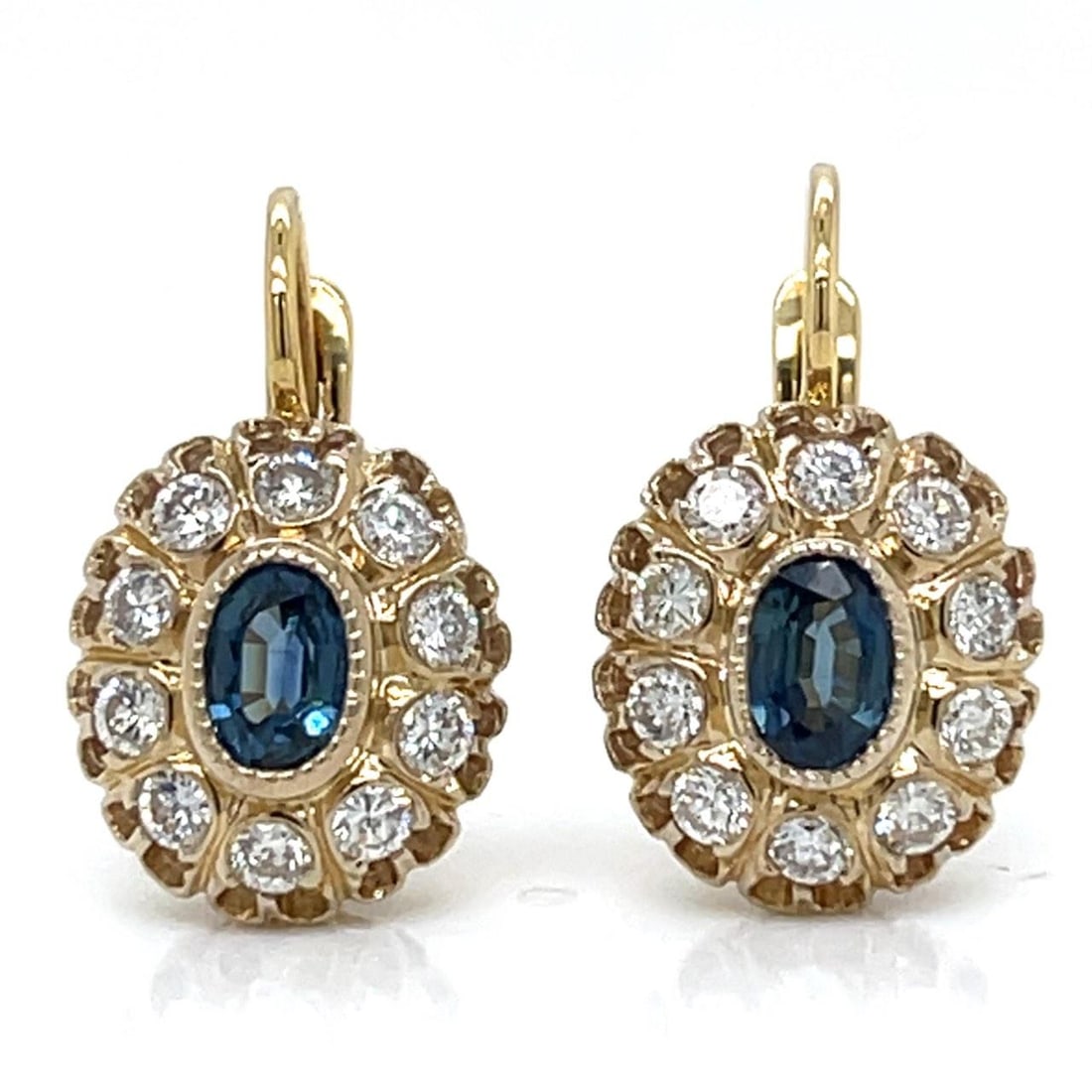 Sapphire and Diamond Earrings in 18K Yellow Gold 1 Inch 10.5g: Sapphire and Diamond Earrings in 18K Yellow Gold 1 Inch 10.5g These elegant earrings are crafted from 18K yellow gold and feature two sapphires with a total weight of approximately 1.30 carats. The sa