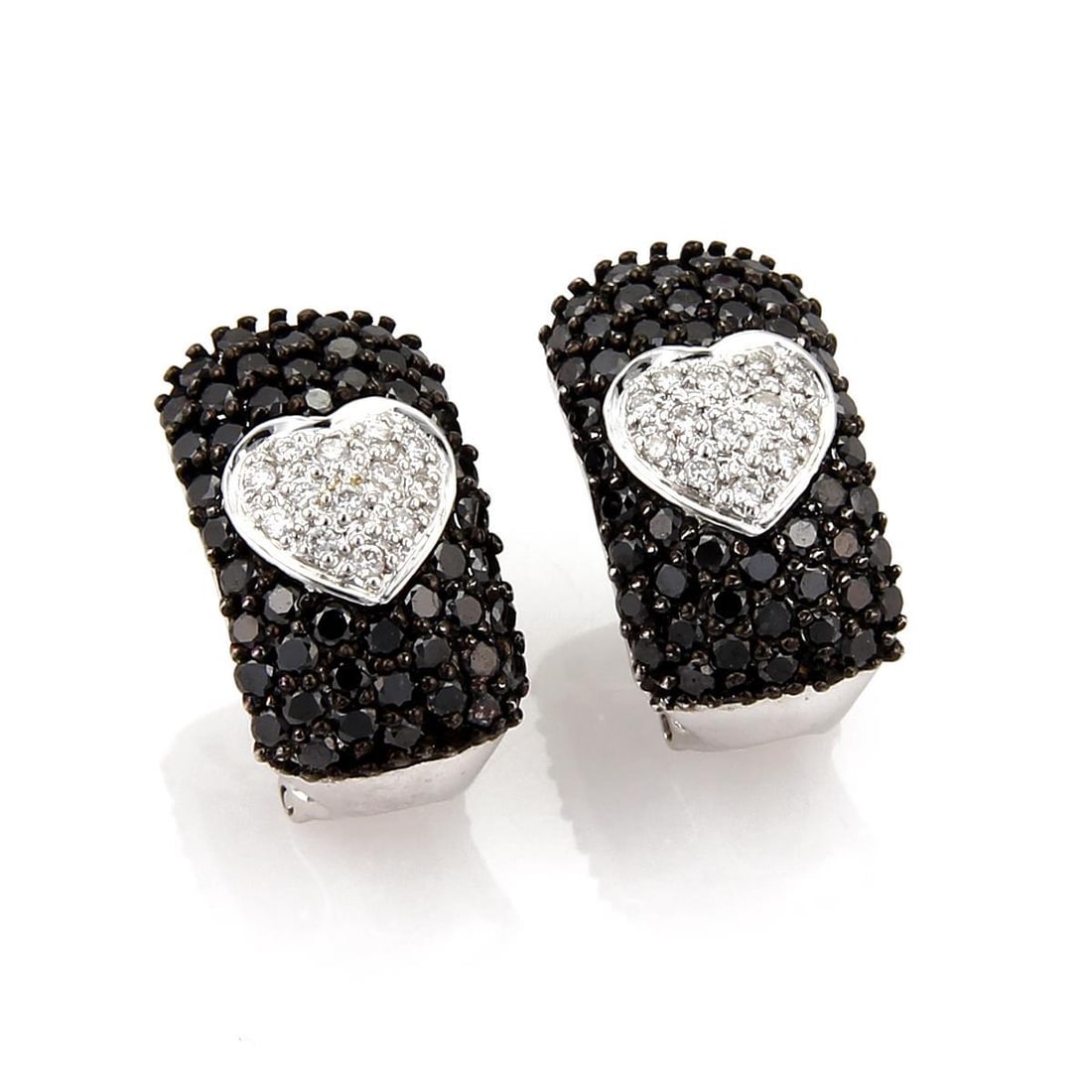 Elegant 4.56 Carat Black & White Diamond Heart Earrings in 18k White Gold: Elegant 4.56 Carat Black & White Diamond Heart Earrings in 18k White Gold This exquisite pair of earrings features a stunning design crafted from 18k white gold. The earrings showcase a long rectangul