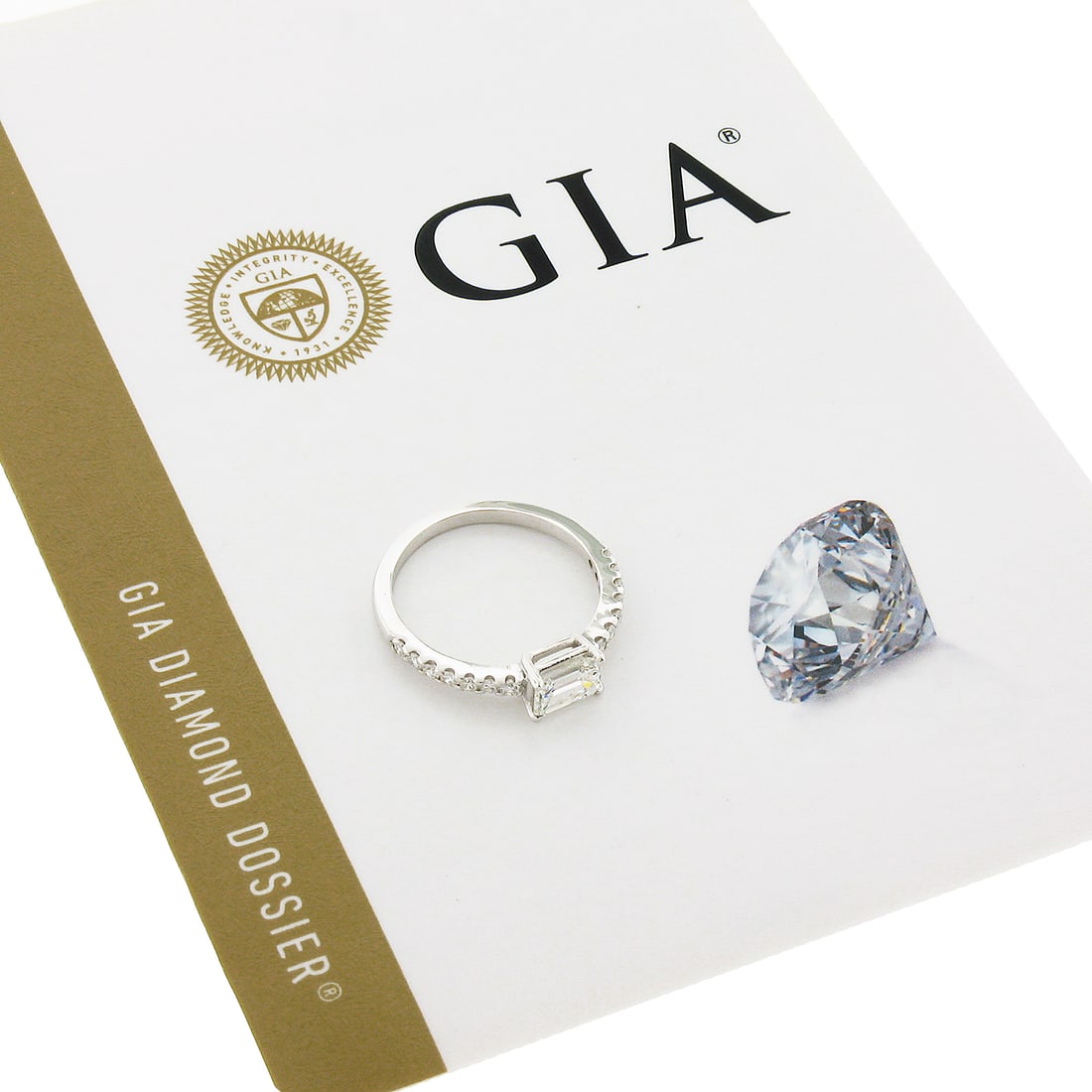 14k White Gold GIA Certified 1.21ct Emerald Cut Diamond Sideways Engagement Ring: 14k White Gold GIA Certified 1.21ct Emerald Cut Diamond Sideways Engagement Ring This enchanting 14k white gold engagement ring showcases a stunning 1.21ct GIA certified emerald cut diamond as the cen