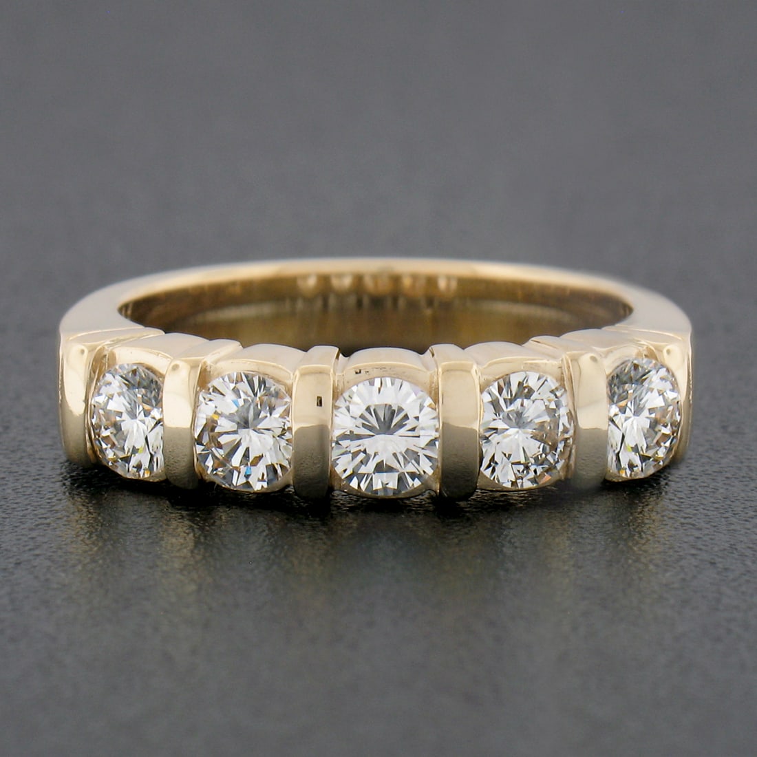 Vintage Yellow Gold 0.85ctw VVS2 Diamond Channel Wedding Band Ring: Vintage Yellow Gold 0.85ctw VVS2 Diamond Channel Wedding Band Ring This exquisite vintage wedding band ring features five stunning natural diamonds, beautifully channel set in solid 14k yellow gold. W
