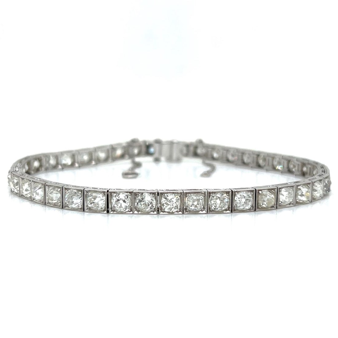 Platinum Diamond Tennis Bracelet Art Deco 11 Carat 8 Inch: Platinum Diamond Tennis Bracelet Art Deco 11 Carat 8 Inch This Art Deco tennis bracelet features 42 European-cut diamonds with a total weight of approximately 11.00 carats, graded G-H color and VVS-VS