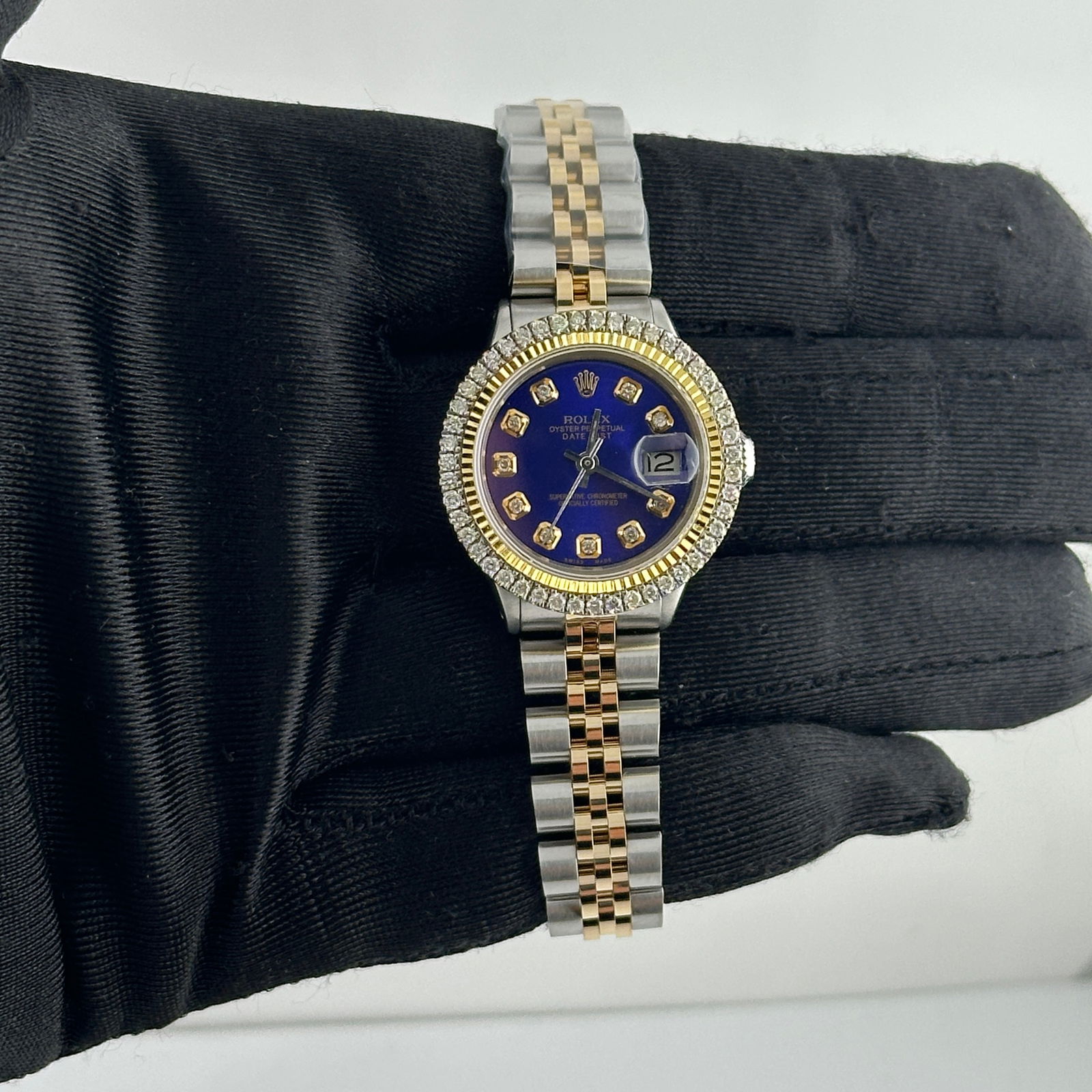 Ladies Datejust Ref 6517 Blue Diamond Dial Aftermarket Jubilee Bracelet: Ladies Datejust Ref 6517 Blue Diamond Dial Aftermarket Jubilee Bracelet This ladies Rolex Datejust features an aftermarket blue diamond dial, an aftermarket Jubilee bracelet, and a prong-set diamond-p