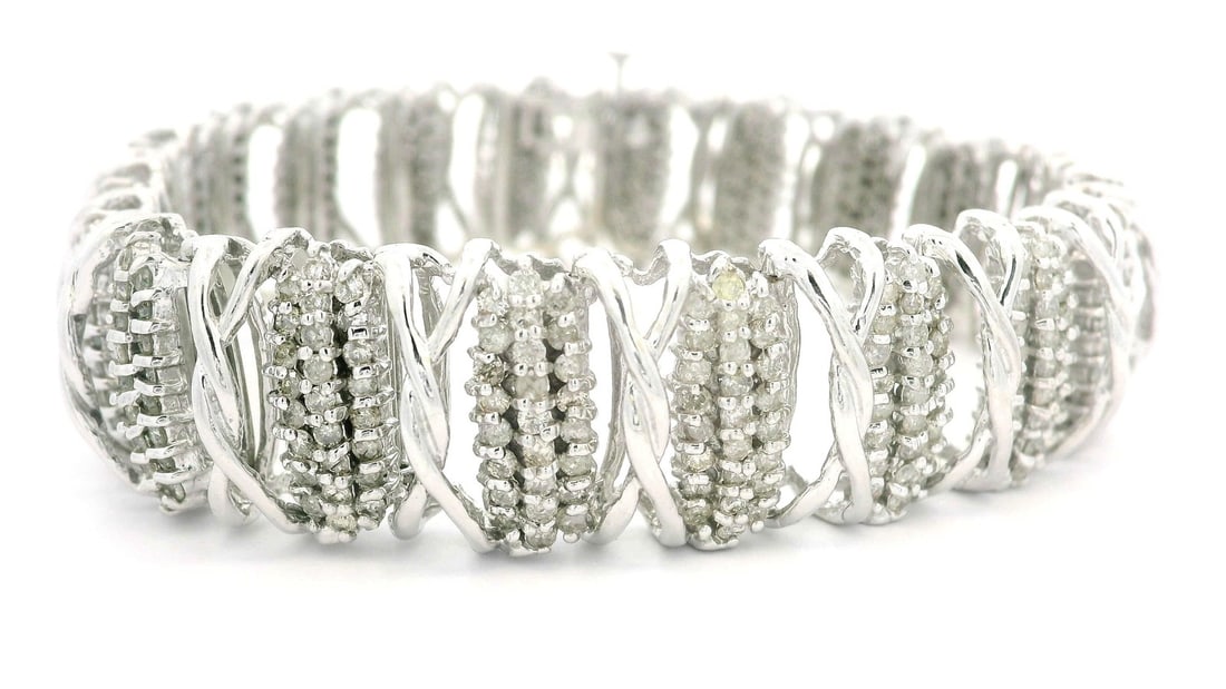 14k White Gold 5ctw Diamond Cluster Link Bracelet 14.8mm Wide: 14k White Gold 5ctw Diamond Cluster Link Bracelet 14.8mm Wide This substantial 14k white gold bracelet features a stunning cluster design adorned with 500 natural genuine diamonds, each cut in a brill
