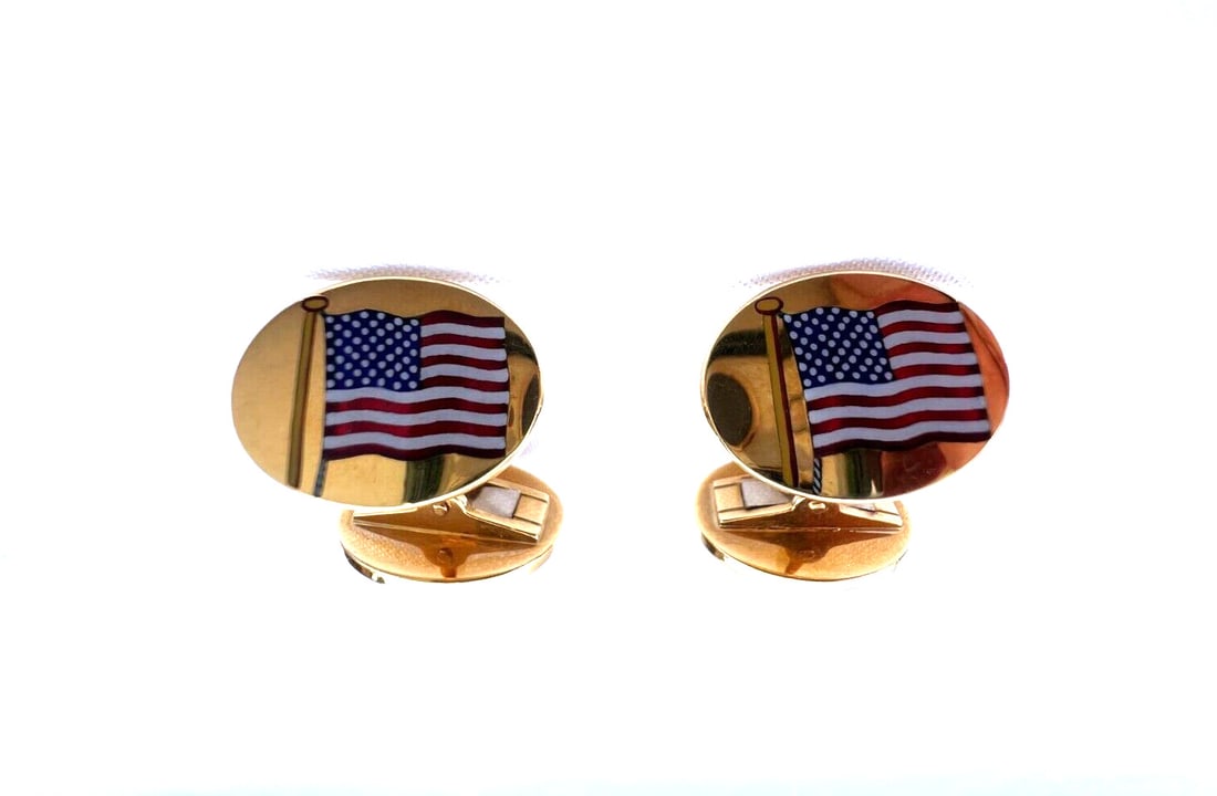 Asprey 18K Gold Enameled Cufflinks US UK Flags: Asprey 18K Gold Enameled Cufflinks US UK Flags Elevate your accessory collection with this exquisite pair of cufflinks by Asprey. Crafted from 18K enameled gold, these cufflinks showcase a stunning de
