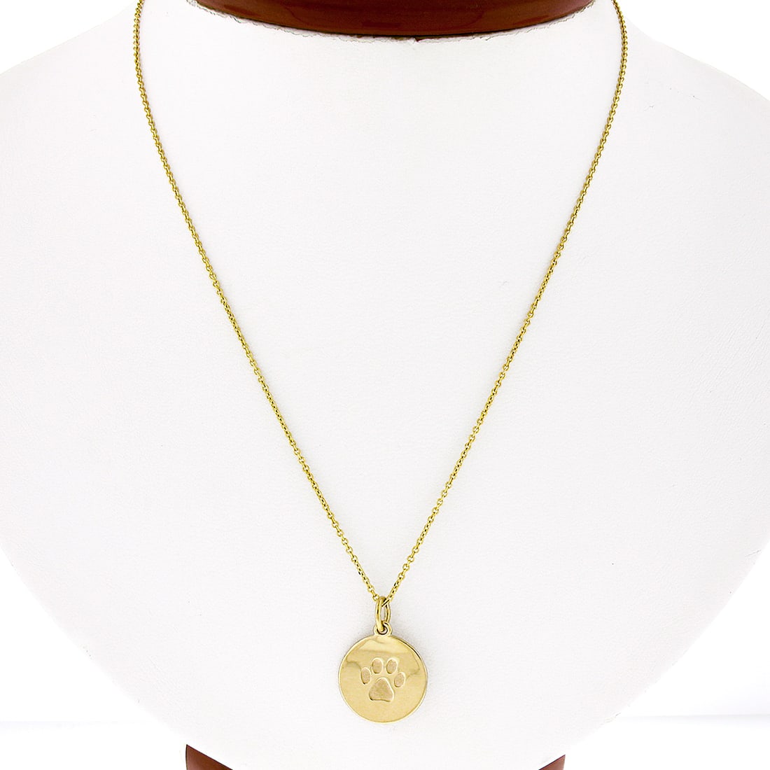 14K Yellow Gold Textured Paw Print Pendant with 16" Cable Chain: 14K Yellow Gold Textured Paw Print Pendant with 16" Cable Chain This charming pendant is crafted from solid 14K yellow gold and features a textured paw print design on a polished medallion disc. The r