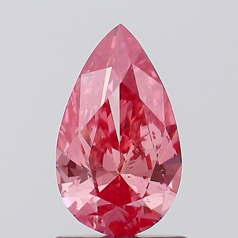 Loose Diamond - PEAR 1.0ct Fancy Vivid Pink SI1: Loose Diamond - PEAR 1.0ct Fancy Vivid Pink SI1 Source: This is a real non-mined Diamond that has been grown in a lab Shape: PEAR Carats: 1.0 Color: Fancy Vivid Pink Certification: IGI Video: Video