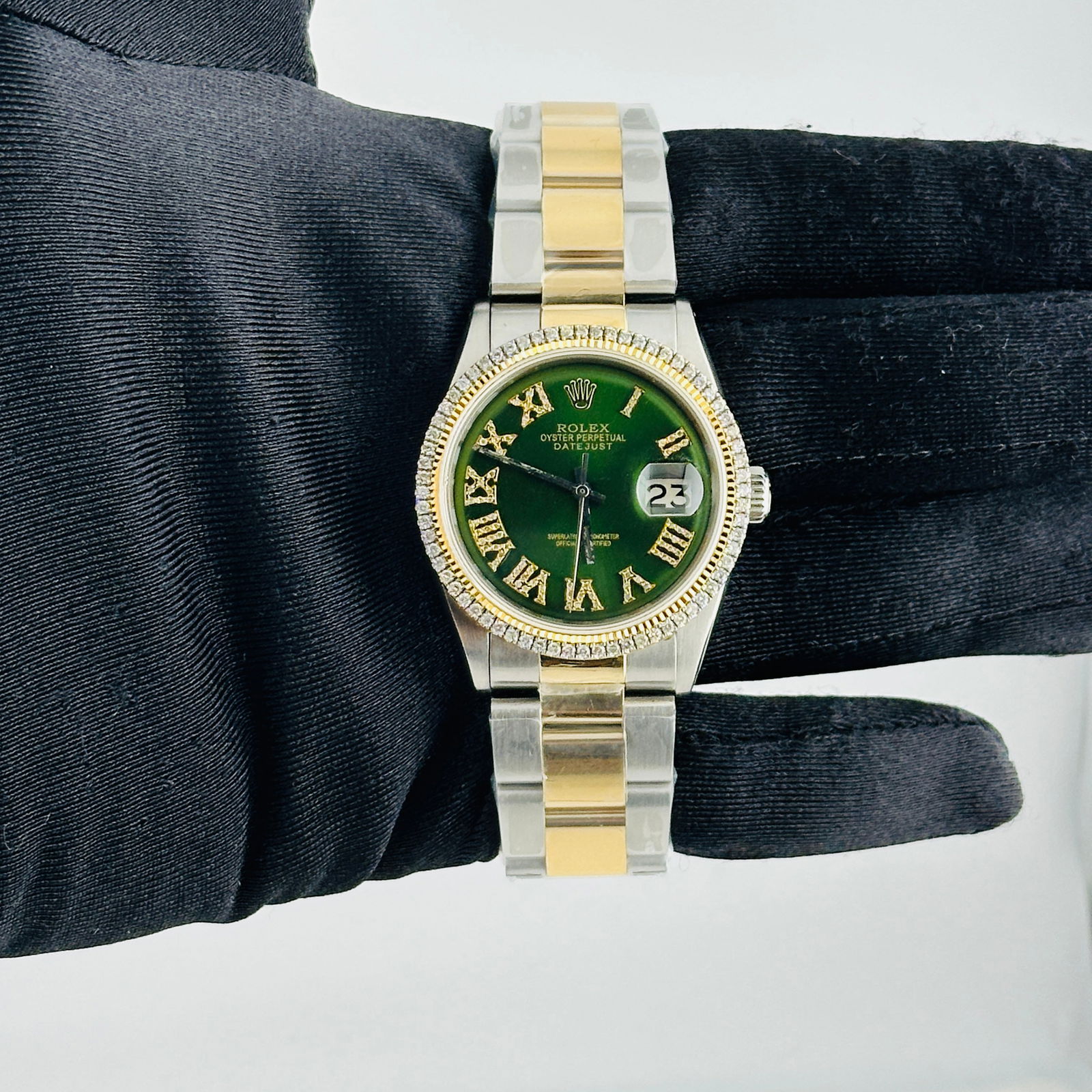 Aftermarket Green Roman Diamond Dial Datejust Oyster Watch Ref 1601: Aftermarket Green Roman Diamond Dial Datejust Oyster Watch Ref 1601 This men's Rolex Datejust features an aftermarket green Roman diamond dial and an aftermarket Oyster bracelet. The watch is identifi