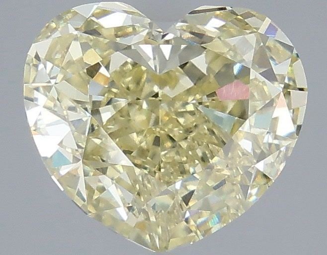 Loose Diamond - HEART 4.07ct Fancy Light Yellow VVS2: Loose Diamond - HEART 4.07ct Fancy Light Yellow VVS2 Source: This is a real non-mined Diamond that has been grown in a lab Shape: HEART Carats: 4.07 Color: Fancy Light Yellow Certification: IGI Video: