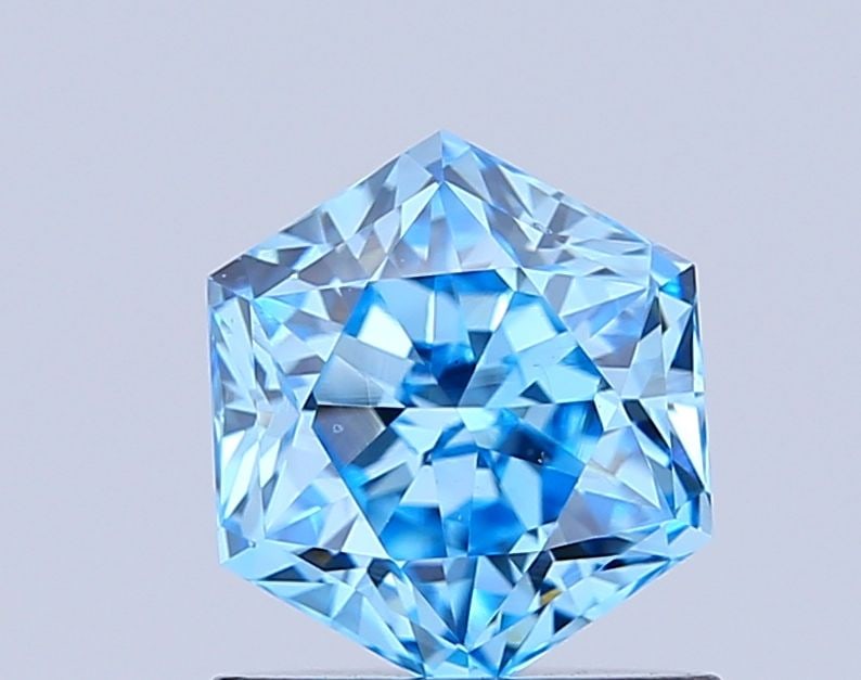 Loose Diamond - HEXAGONAL 1.01ct Fancy Vivid Blue VS1: Loose Diamond - HEXAGONAL 1.01ct Fancy Vivid Blue VS1 Source: This is a real non-mined Diamond that has been grown in a lab Shape: HEXAGONAL Carats: 1.01 Color: Fancy Vivid Blue Certification: IGI Vid