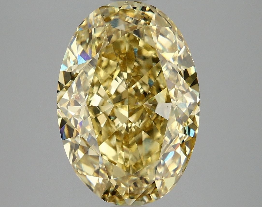 Loose Diamond - OVAL 5.1ct Fancy Vivid Yellow VS2: Loose Diamond - OVAL 5.1ct Fancy Vivid Yellow VS2 Source: This is a real non-mined Diamond that has been grown in a lab Shape: OVAL Carats: 5.1 Color: Fancy Vivid Yellow Certification: IGI Video: