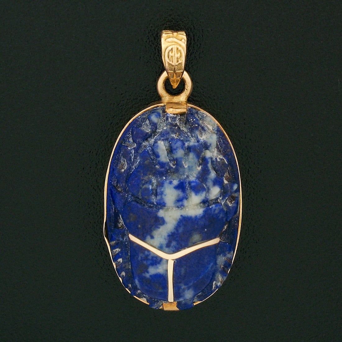 Antique 18k Yellow Gold Lapis Scarab Pendant with Gold Inlay: Antique 18k Yellow Gold Lapis Scarab Pendant with Gold Inlay This exquisite antique pendant is meticulously crafted from solid 18k yellow gold, showcasing a stunning carved lapis lazuli scarab gemston