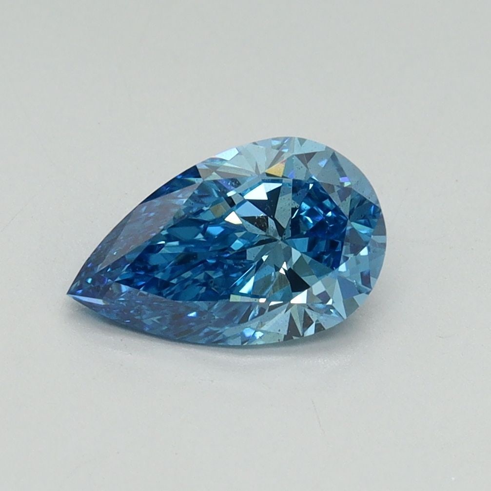 Loose Diamond - PEAR 1.0ct Fancy Vivid Blue SI1: Loose Diamond - PEAR 1.0ct Fancy Vivid Blue SI1 Source: This is a real non-mined Diamond that has been grown in a lab Shape: PEAR Carats: 1.0 Color: Fancy Vivid Blue Certification: IGI Video: