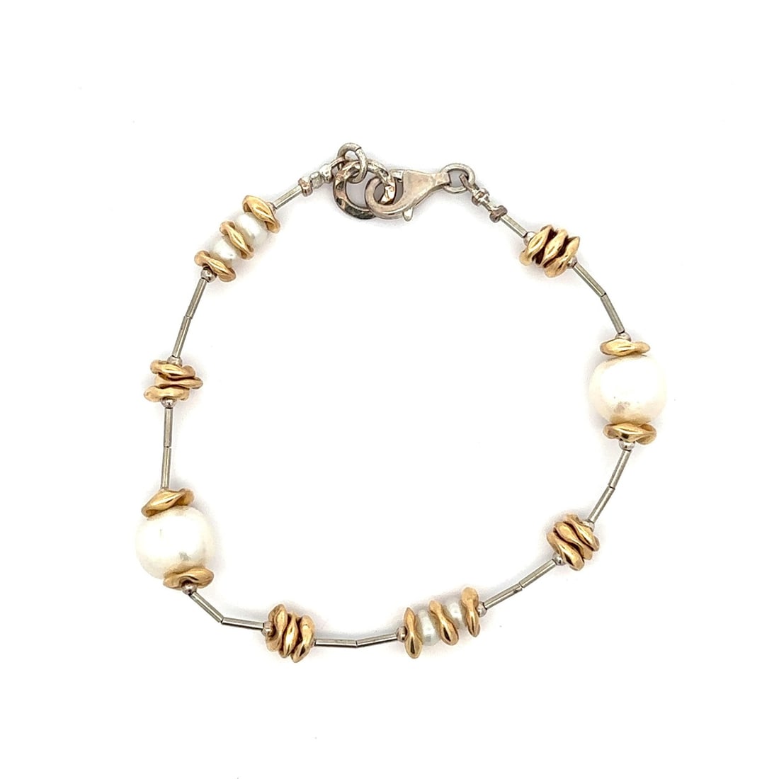 Vintage Sterling Silver Gold Filled Pearl Floral Bracelet 7.5 Inch: Vintage Sterling Silver Gold Filled Pearl Floral Bracelet 7.5 Inch This exquisite vintage bracelet features a stunning combination of alternating genuine cultured pearls and floral beads, elegantly st