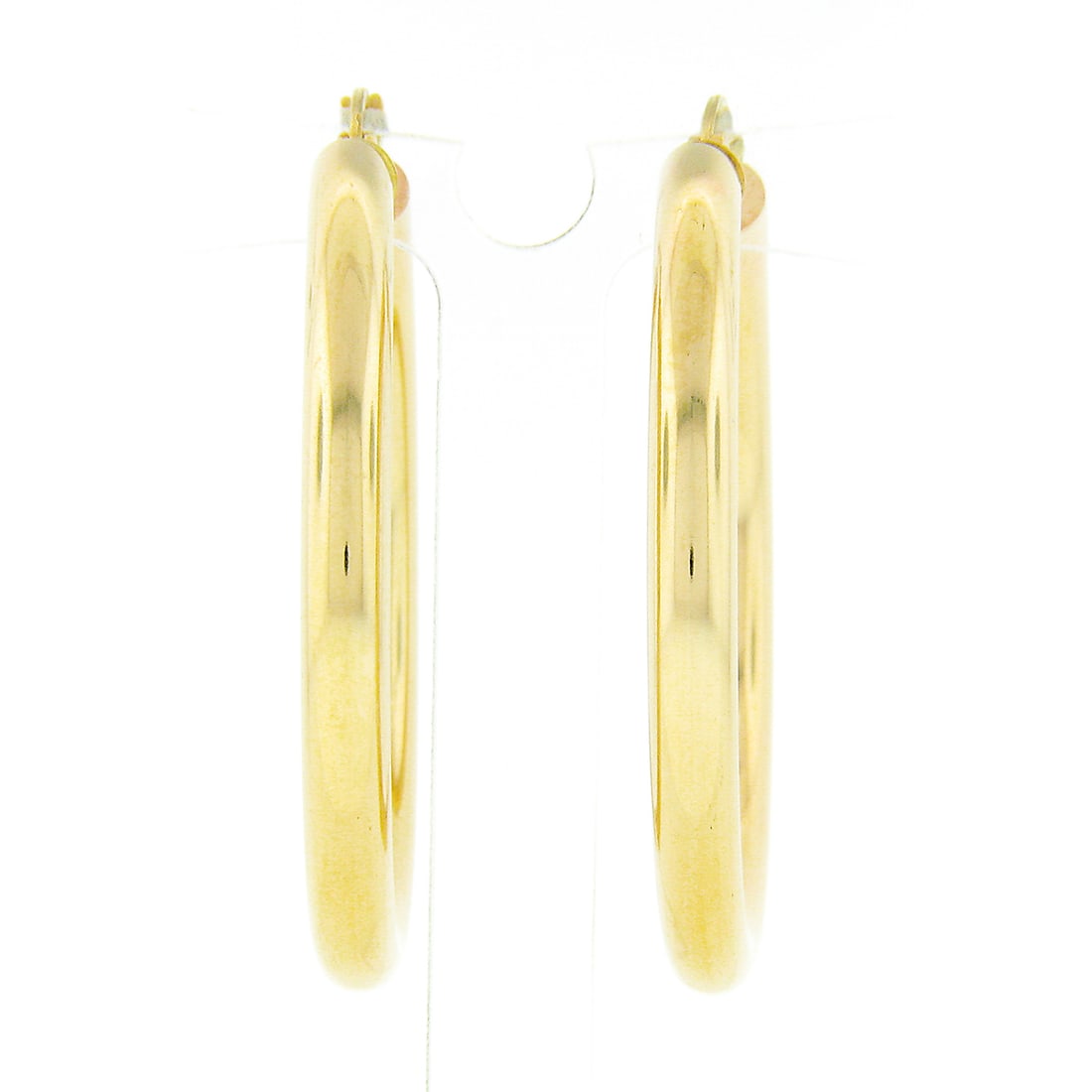 Classic 14K Yellow Gold 3.9mm Round Hoop Snap Earrings: Classic 14K Yellow Gold 3.9mm Round Hoop Snap Earrings These classic round hoop earrings are crafted from solid 14K yellow gold, showcasing a sleek 3.9mm wide plain polished design. The earrings featu