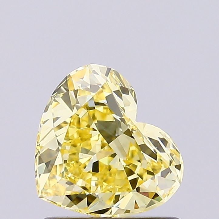 Loose Diamond - HEART 0.87ct Fancy Vivid Yellow VS1: Loose Diamond - HEART 0.87ct Fancy Vivid Yellow VS1 Source: This is a real non-mined Diamond that has been grown in a lab Shape: HEART Carats: 0.87 Color: Fancy Vivid Yellow Certification: NONE Video: