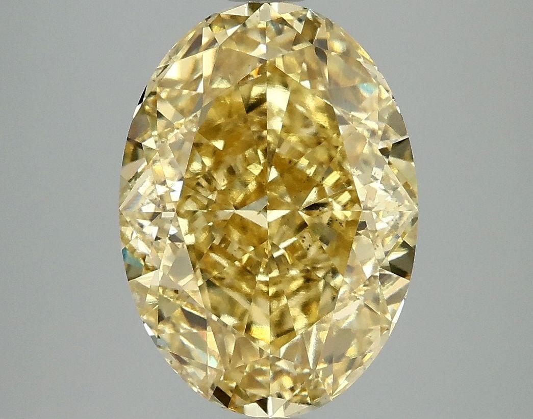 Loose Diamond - OVAL 4.9ct Fancy Vivid Yellow VS2: Loose Diamond - OVAL 4.9ct Fancy Vivid Yellow VS2 Source: This is a real non-mined Diamond that has been grown in a lab Shape: OVAL Carats: 4.9 Color: Fancy Vivid Yellow Certification: IGI Video: