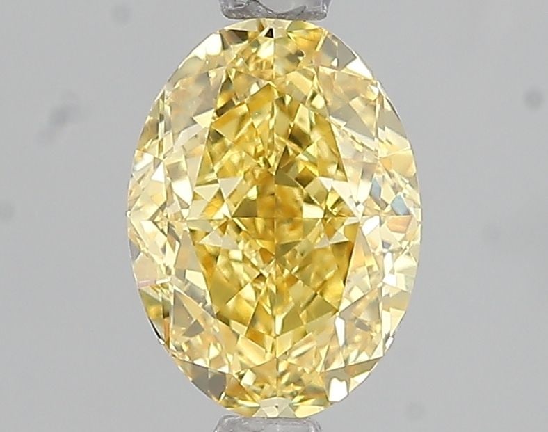 Loose Diamond - OVAL 1.6ct Fancy Vivid Yellow VVS2: Loose Diamond - OVAL 1.6ct Fancy Vivid Yellow VVS2 Source: This is a real non-mined Diamond that has been grown in a lab Shape: OVAL Carats: 1.6 Color: Fancy Vivid Yellow Certification: IGI Video: