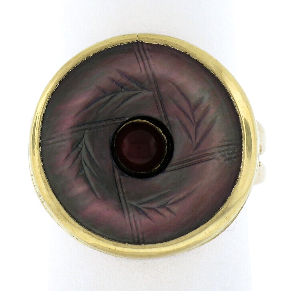 14k Yellow Gold Carved Black Mother of Pearl Carnelian Button Ring: 14k Yellow Gold Carved Black Mother of Pearl Carnelian Button Ring This exquisite cocktail button ring showcases a stunning round carved black mother of pearl, elegantly bezel set in solid 14k yellow
