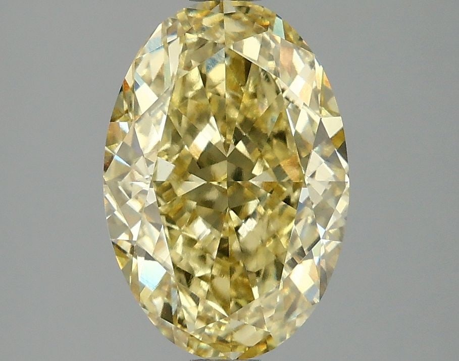 Loose Diamond - OVAL 3.04ct Fancy Vivid Yellow VS1: Loose Diamond - OVAL 3.04ct Fancy Vivid Yellow VS1 Source: This is a real non-mined Diamond that has been grown in a lab Shape: OVAL Carats: 3.04 Color: Fancy Vivid Yellow Certification: IGI Video: