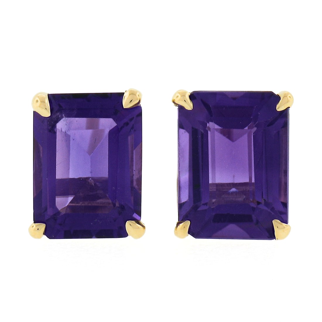 14k Yellow Gold 2.64ct Emerald Cut Amethyst Stud Earrings: 14k Yellow Gold 2.64ct Emerald Cut Amethyst Stud Earrings Introducing a stunning pair of stud earrings crafted from solid 14k yellow gold, featuring two natural, genuine emerald cut amethyst stones. E