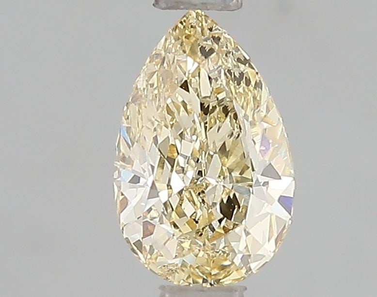 Loose Diamond - PEAR 1.0ct Fancy Yellow VS2: Loose Diamond - PEAR 1.0ct Fancy Yellow VS2 Source: This is a real non-mined Diamond that has been grown in a lab Shape: PEAR Carats: 1.0 Color: Fancy Yellow Certification: IGI Video: