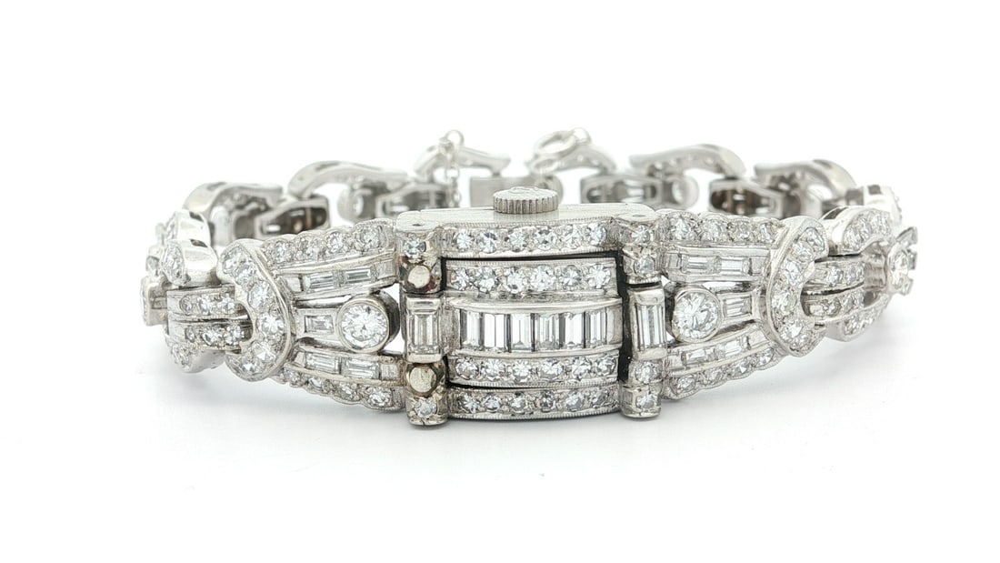 Vintage Hamilton Platinum 7.86ctw Round Baguette Diamond Hidden Watch Bracelet: Vintage Hamilton Platinum 7.86ctw Round Baguette Diamond Hidden Watch Bracelet Discover the elegance of this Vintage Hamilton Platinum Watch, featuring a stunning 7.86ctw of round and baguette diamond