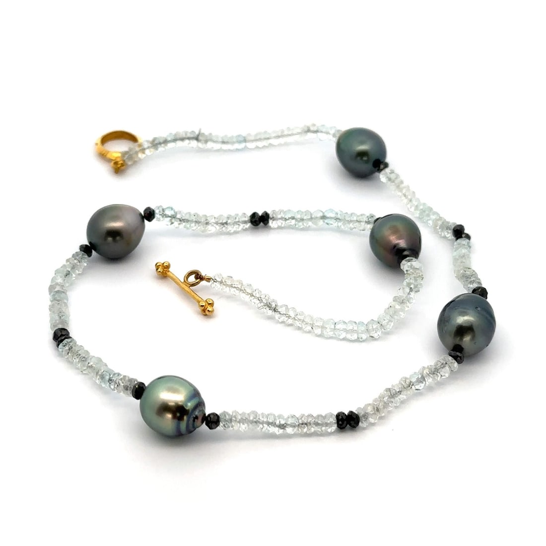 16 Inch Gray Tahitian Pearl and Rock Crystal Necklace with 18k Gold Clasp: 16 Inch Gray Tahitian Pearl and Rock Crystal Necklace with 18k Gold Clasp This exquisite 16-inch necklace features a stunning combination of genuine cultured Tahitian pearls and natural rock crystals.