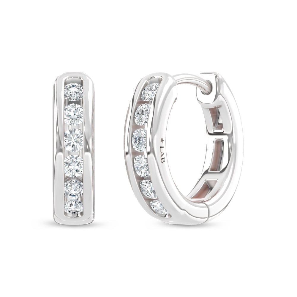 10K White Gold Lab Grown Diamond Channel set 1/4 Ct.Tw. Hoop Earrings: 10K White Gold Lab Grown Diamond Channel set 1/4 Ct.Tw. Hoop Earrings Sleek 10K white gold hoops with 1/4 Ct.Tw. lab-grown diamonds in channel setting. 10k White Gold Stone Color: D-f Stone Clarity: V